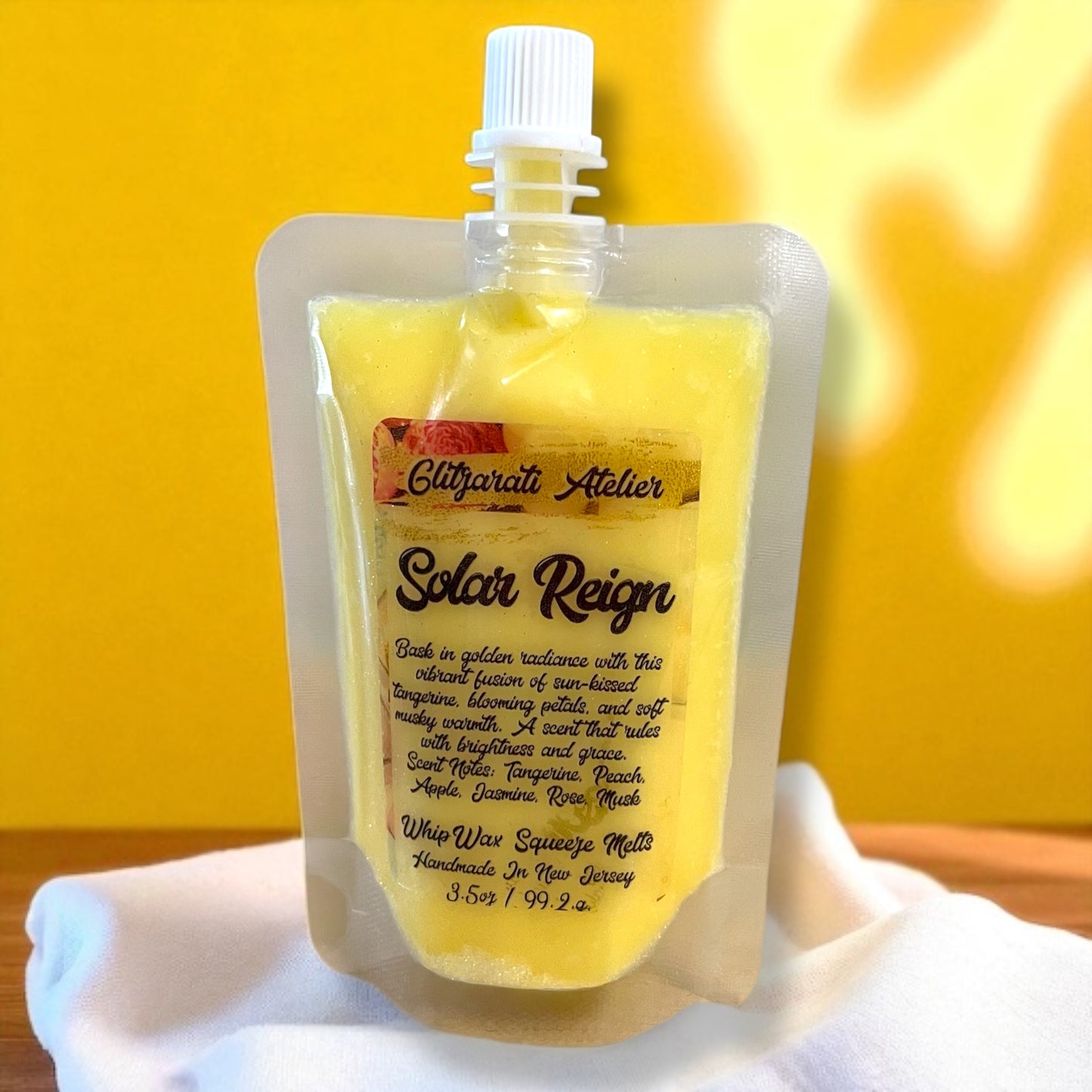 Yellow wax packaging with a white cap on a white surface against a yellow background