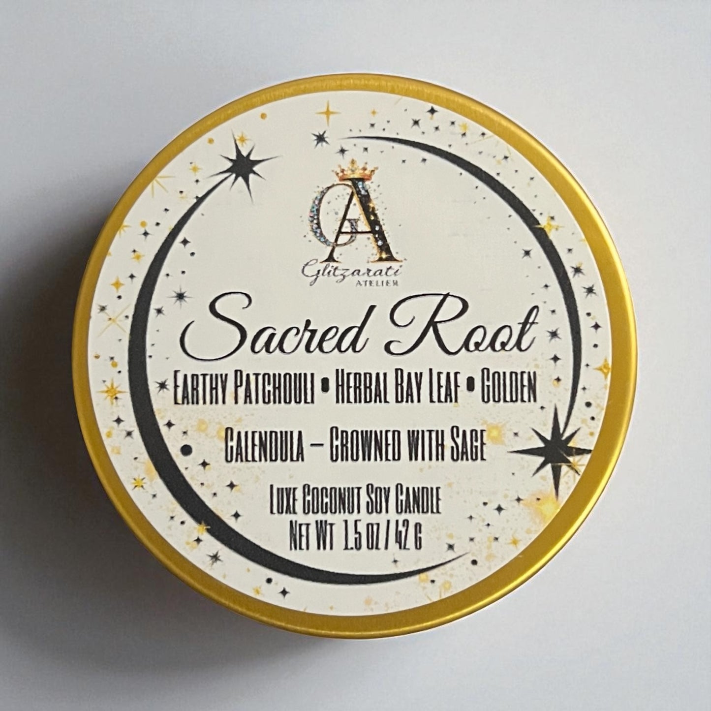Candle tin labeled 'Sacred Root' with decorative design on a gray background