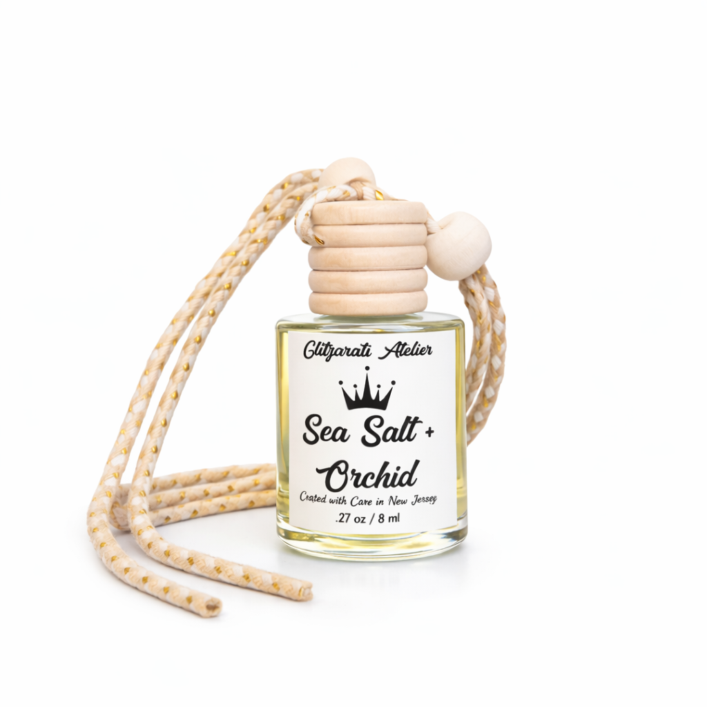 Car air freshener with 'Sea Salt + Orchid' fragrance on a white background