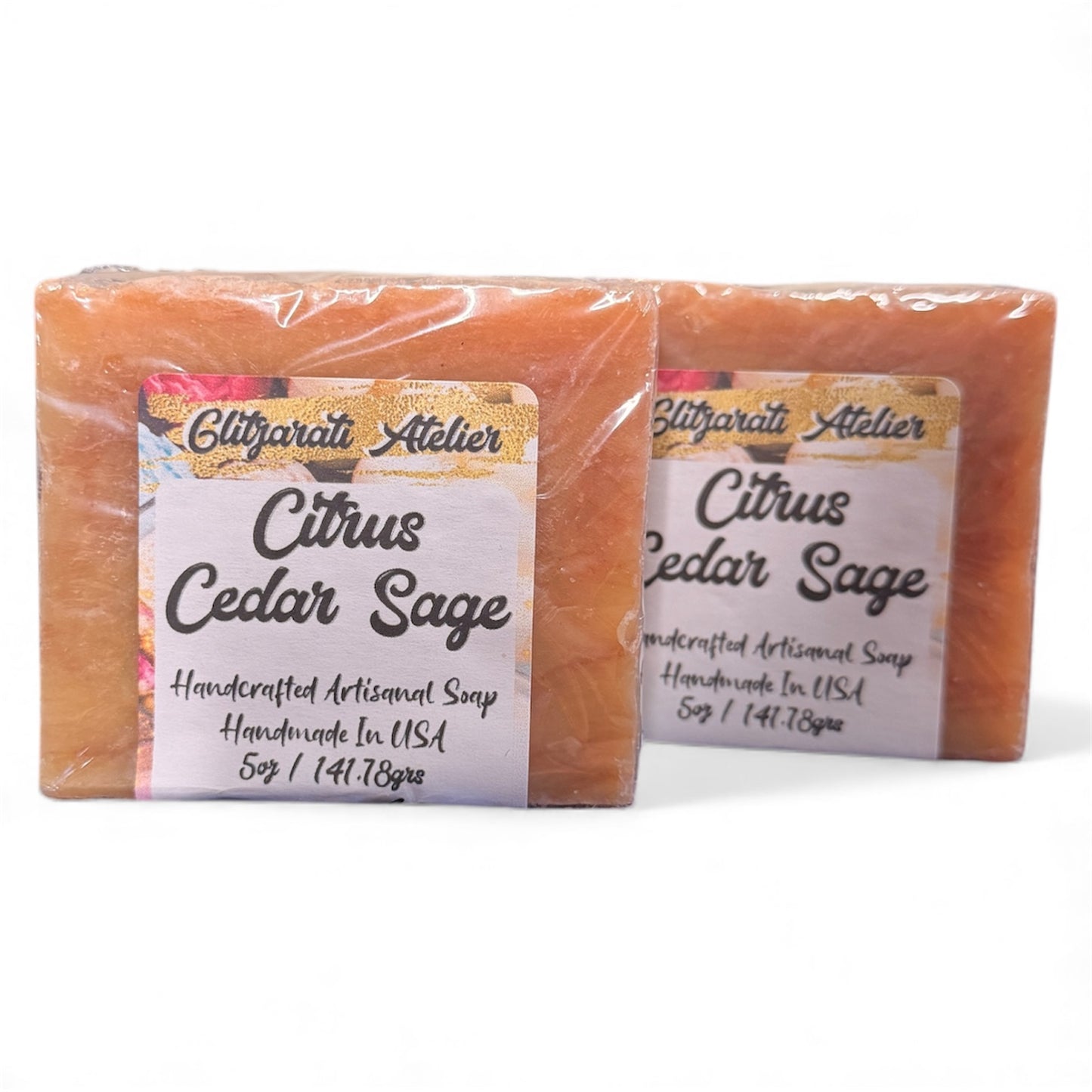 Two bars of Citrus Cedar Sage soap with labels on a white background