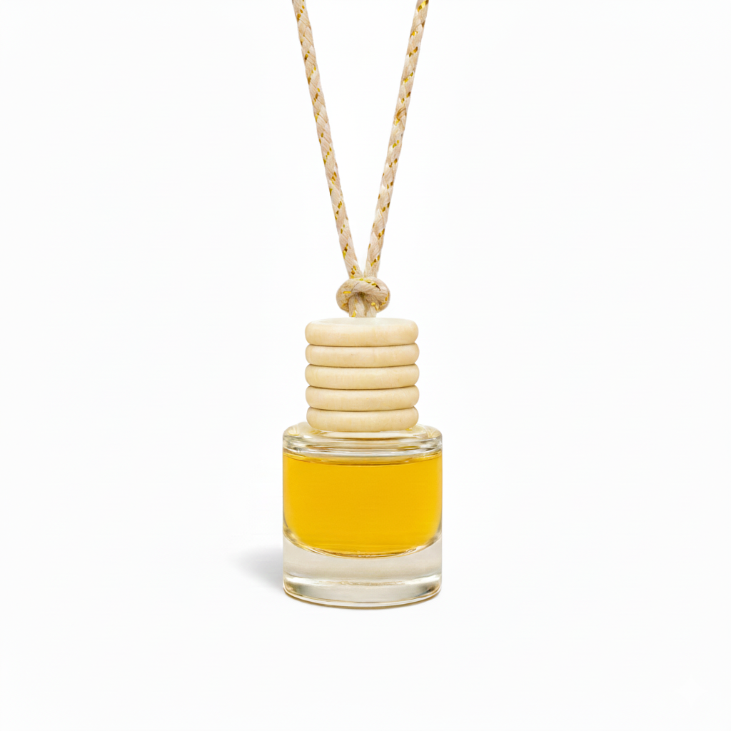 Small glass bottle with yellow liquid and wooden beads on a white background