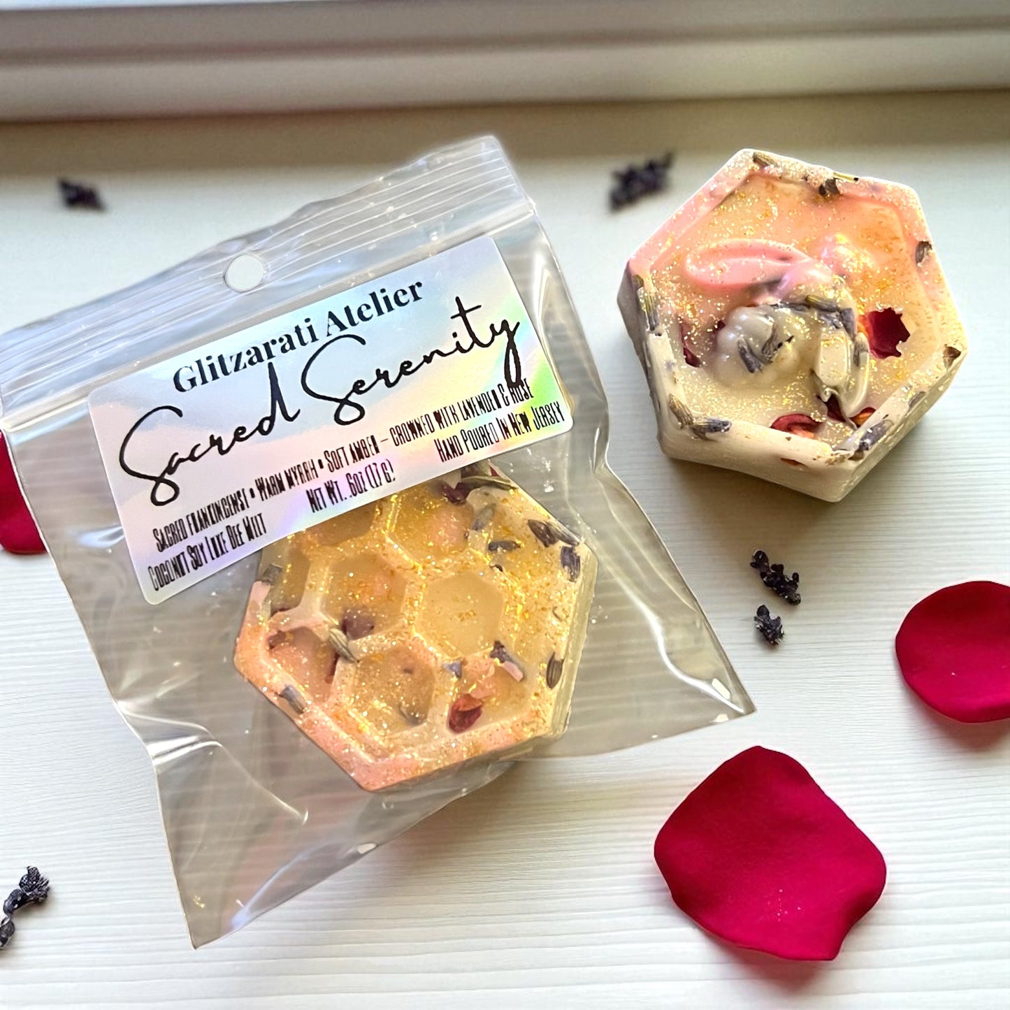 Two hexagonal wax melts with 'Glizzardi Atelier Sacred Serenity' label on a white surface.