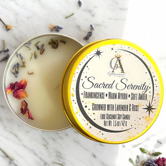 Candle in a tin with decorative elements on a marble surface