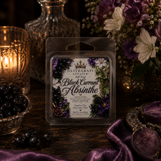 Packaged Black Currant Absinthe soap with decorative elements on a dark background