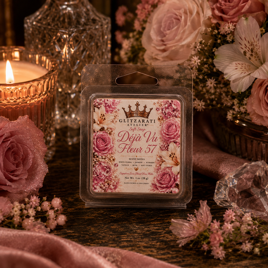 Floral wax melt packaging with roses and a lit candle on a decorative surface