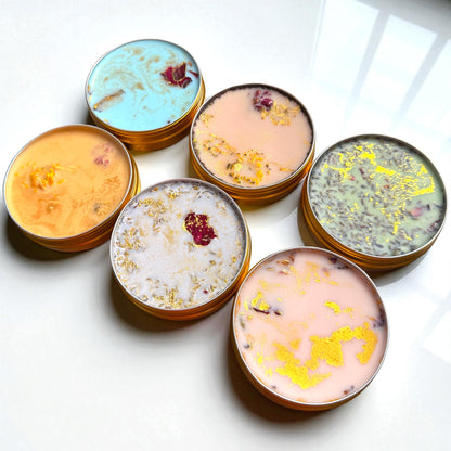 Set of colorful bath bombs with decorative elements on a white surface