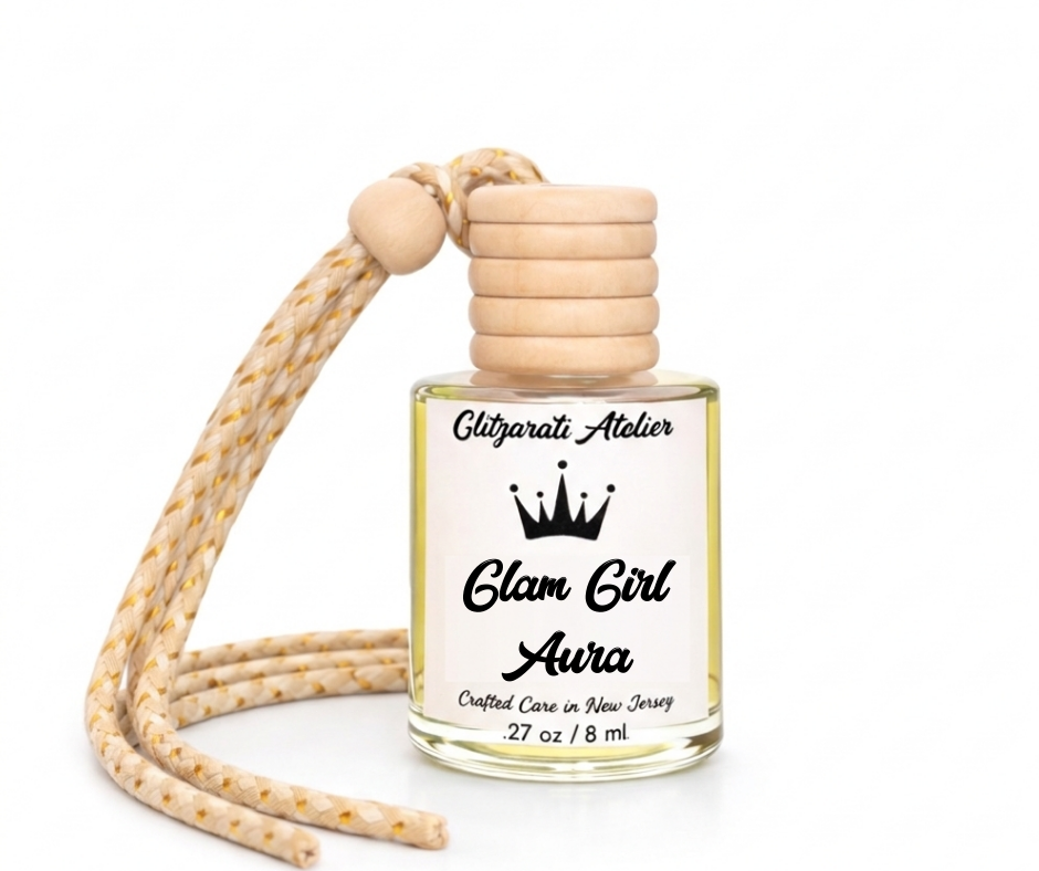 Perfume bottle with wooden top and strap labeled 'Glam Girl Aura' on a white background