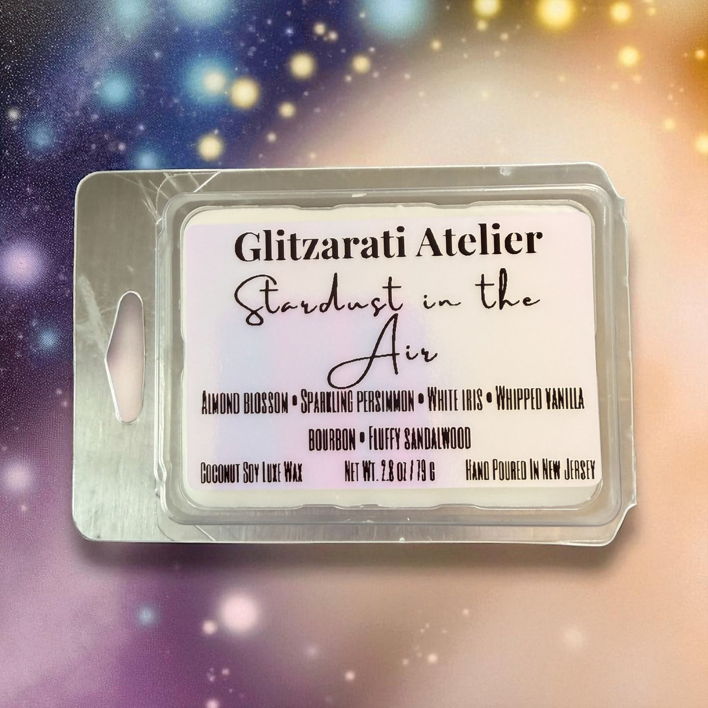 Wax melt packaging with 'Glitzarati Atelier' branding and product details on a starry background.