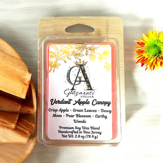 Scented wax melt package with branding and product details on a wooden surface.