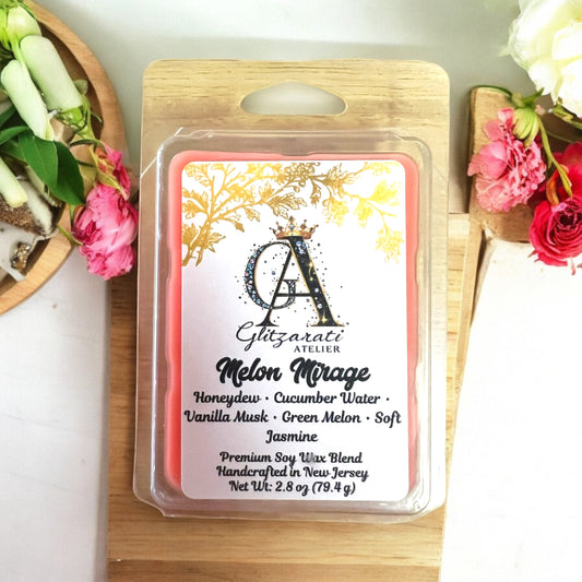 Scented wax melt package with floral design and branding on a wooden surface.