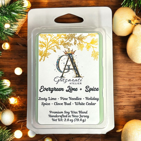 Gltizarati Atelier wax melt packaging with Christmas decorations on a wooden surface