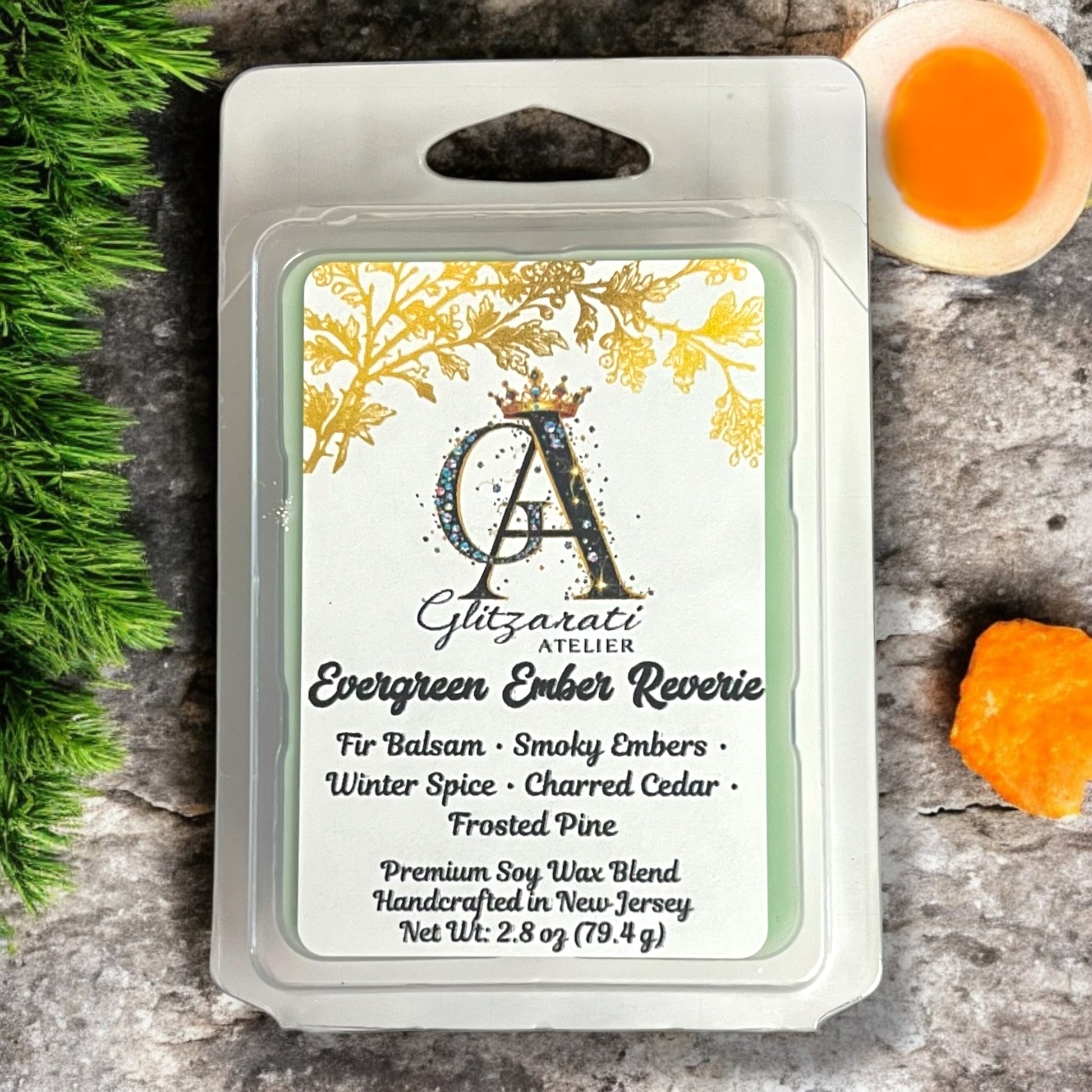 Wax melt packaging with brand label on a textured surface with decorative elements