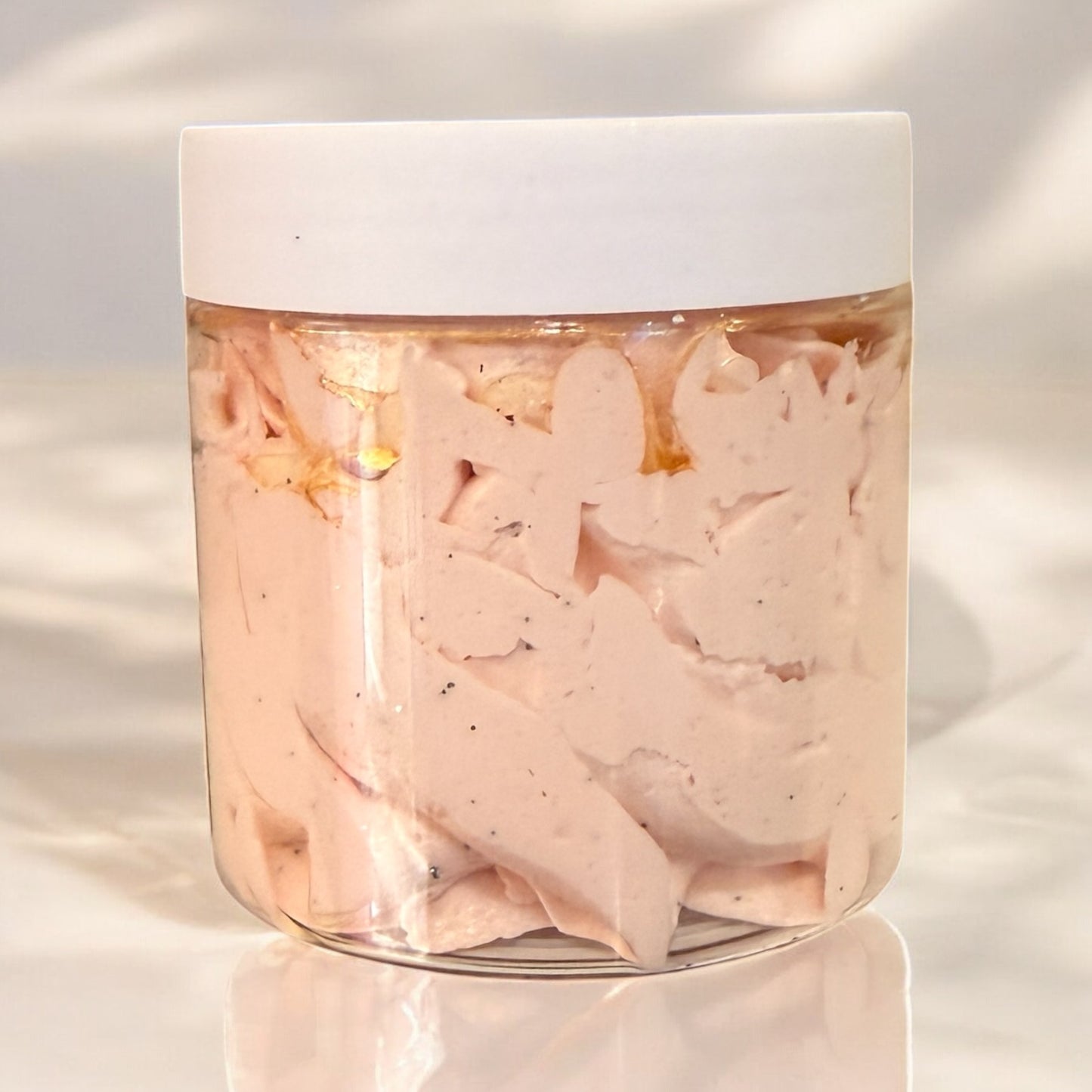 Jar of pinkish-brown pet food on a light background