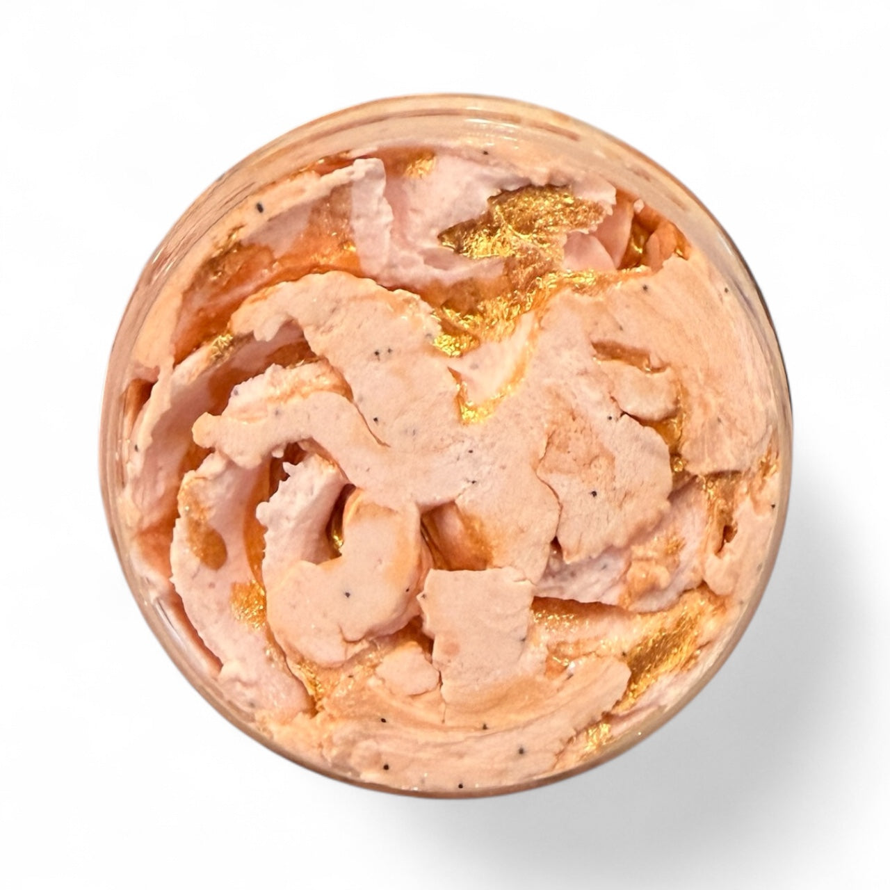 Pink cream with gold flakes in a container on a white background