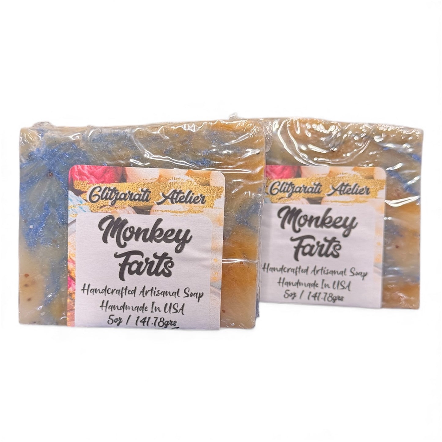 Two bars of 'Monkey Farts' soap with labels on a white background