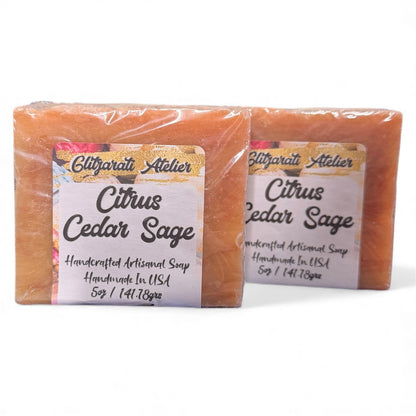 Two bars of Citrus Cedar Sage soap with labels on a white background