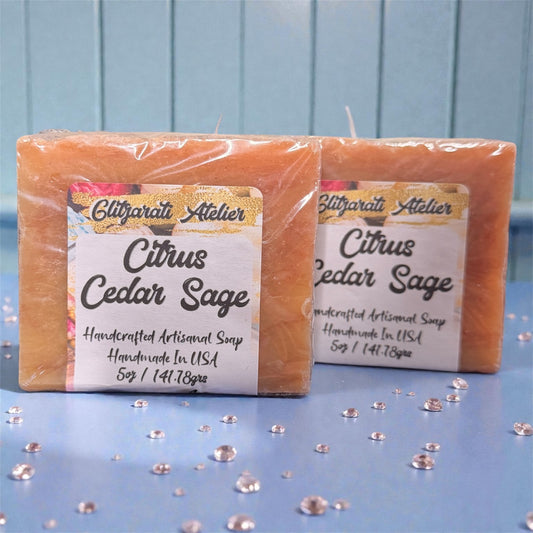 Two bars of Citrus Cedar Sage soap with a visible label on a blue background.