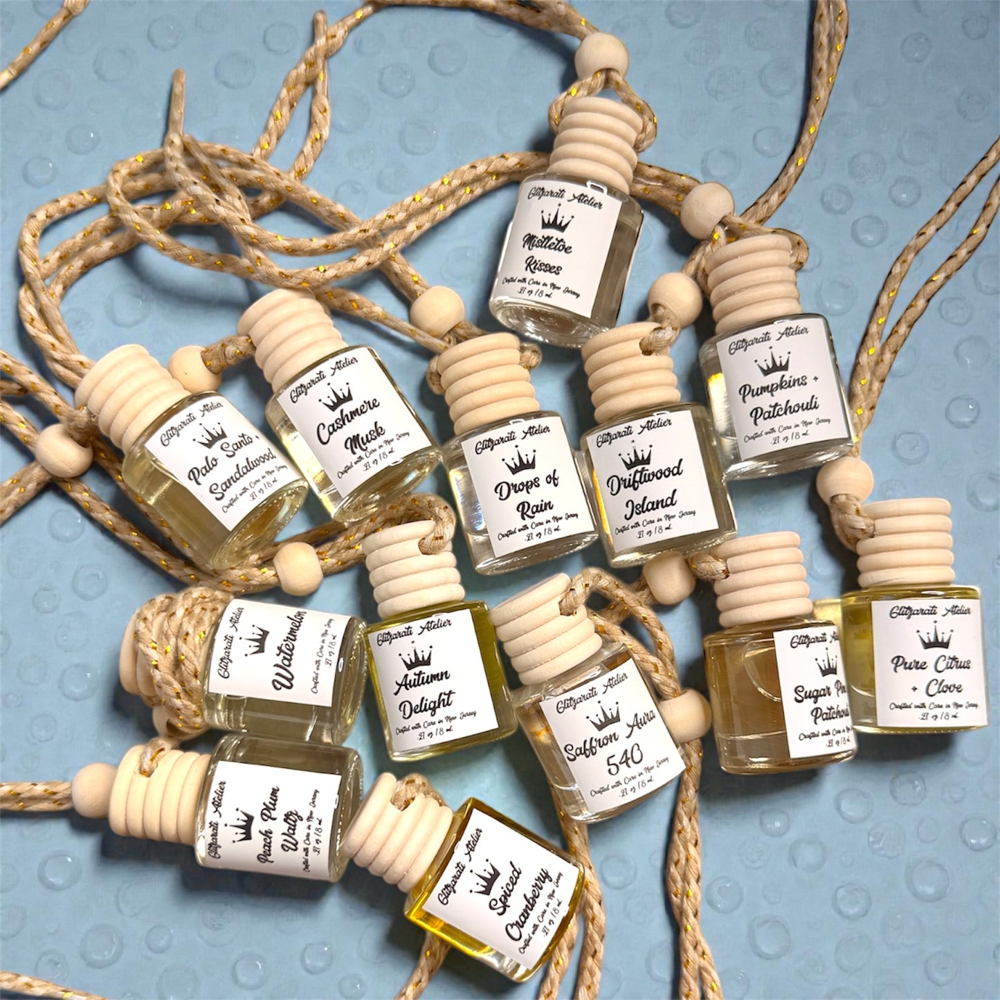 Small bottles with labels on a textured surface