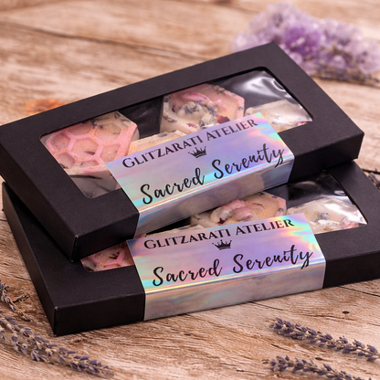 Box of 'Sacred Serenity' soap bars with 'Glitzarati Atelier' branding on a wooden surface.