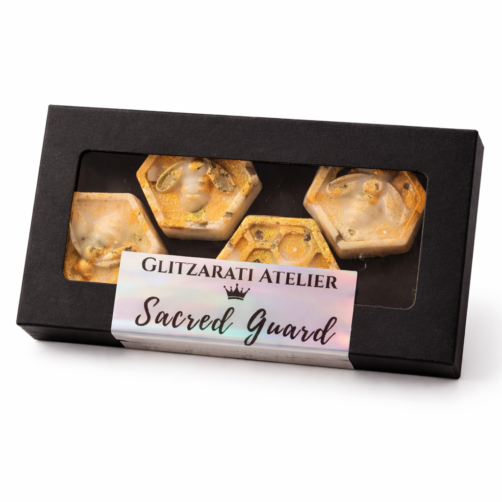Box of hexagonal stone products with 'Glitzarati Atelier Sacred Guard' label on a white background