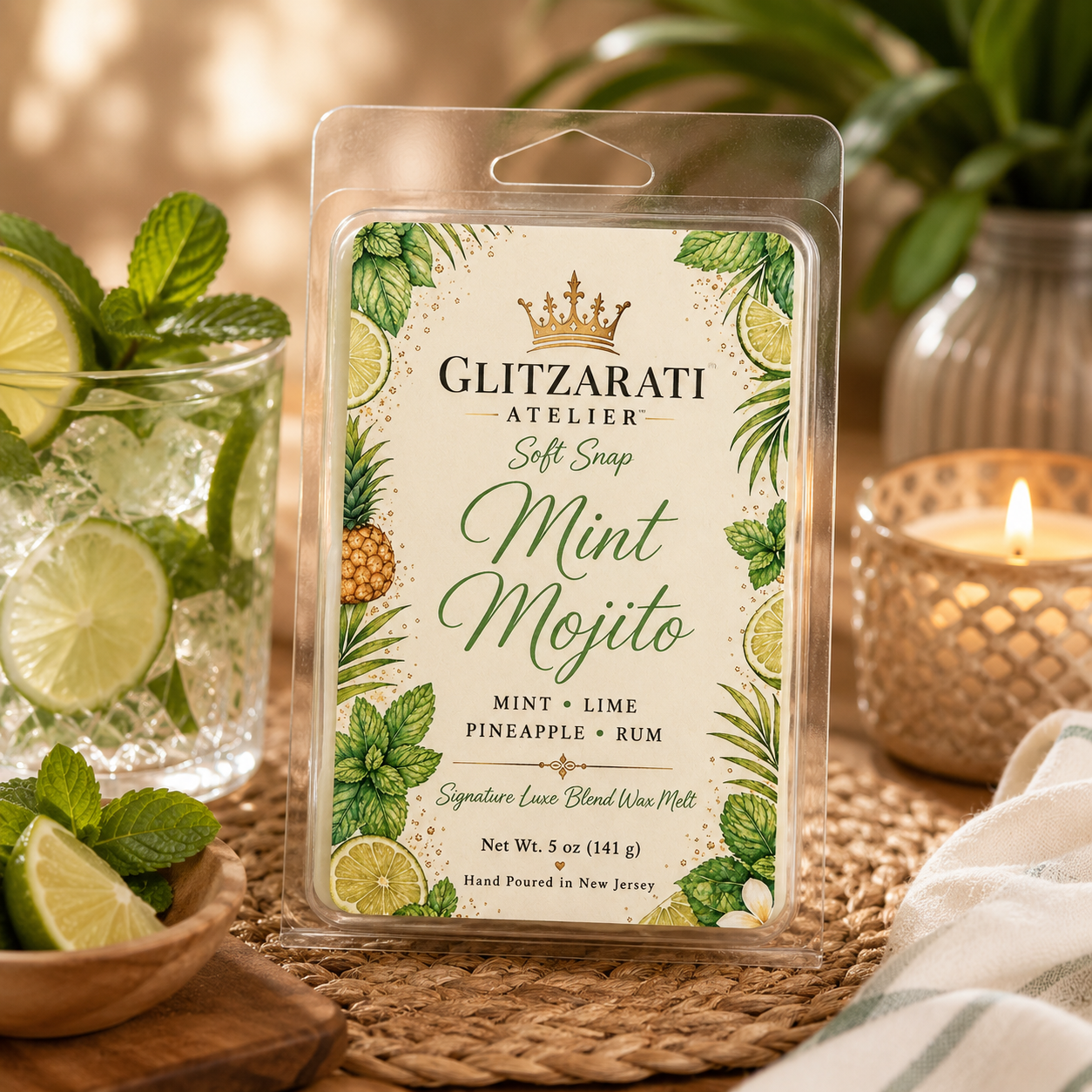 Glitzarati Atelier Mint Mojito wax melt packaging with a refreshing drink setup in the background.
