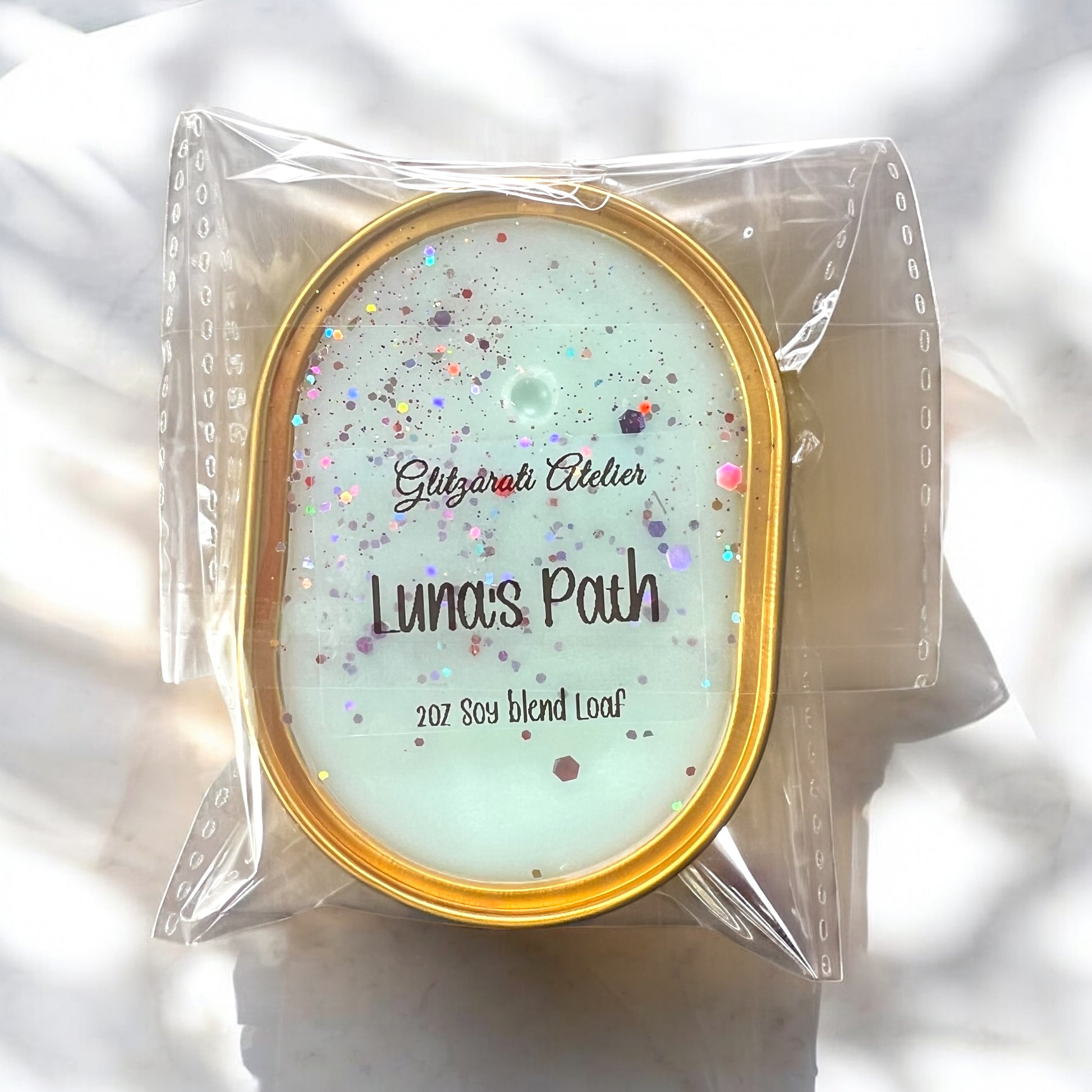 Packaged soap loaf with 'Luna's Path' branding on a white background