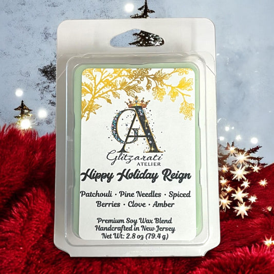 Wax melt packaging with 'Glitzerati Atelier' branding on a festive background