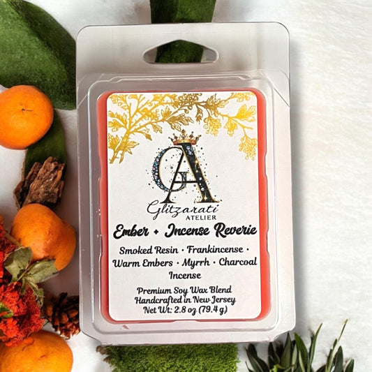 Wax melt packaging with brand label and product details, surrounded by decorative elements.