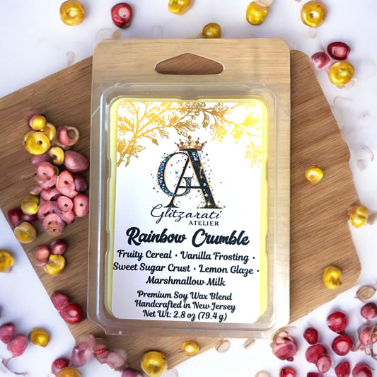 Giltazaris Rainbow Crumble wax melt packaging on a wooden board with colorful candies.