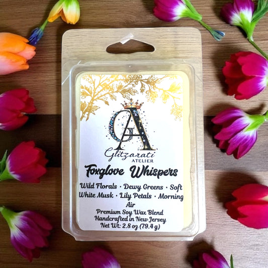 Soy wax melt package with floral design and product details on a wooden surface with flowers.