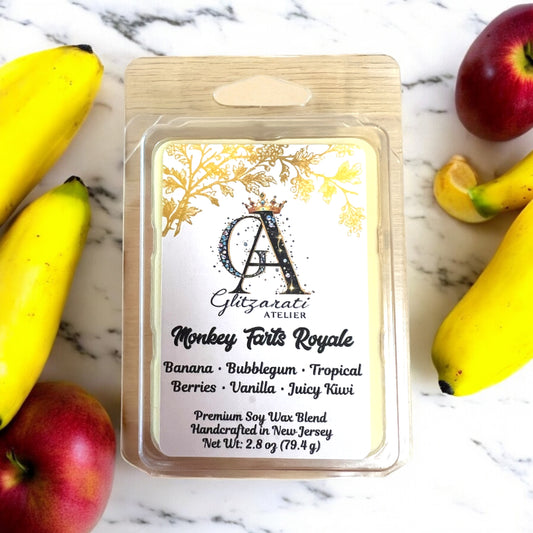 Wax melt package labeled 'Monkey Farts Royale' with fruit-themed design on a marble surface.