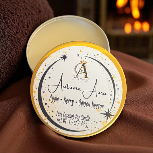 Candle labeled 'Autumn Aura' with a warm glow in the background