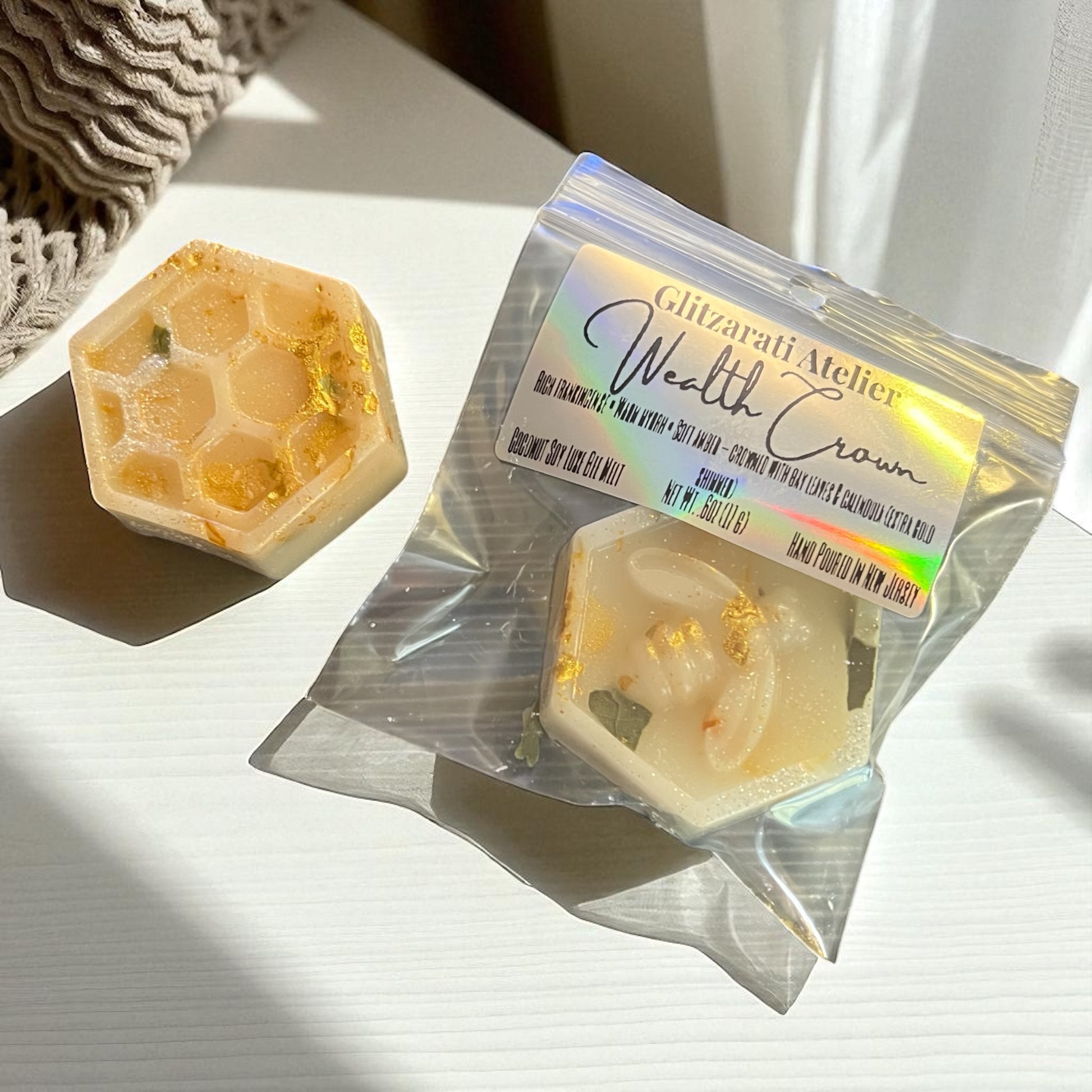 Hexagonal soap with a branded packaging on a light surface