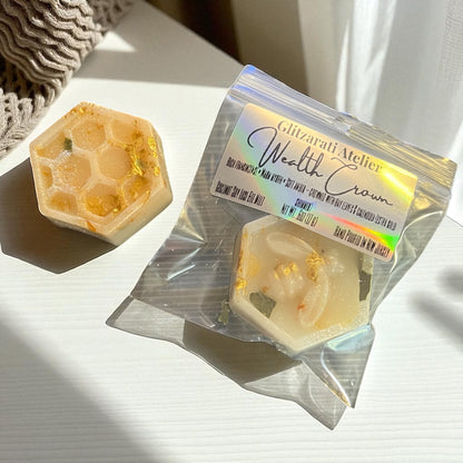 Hexagonal soap with a branded packaging on a light surface