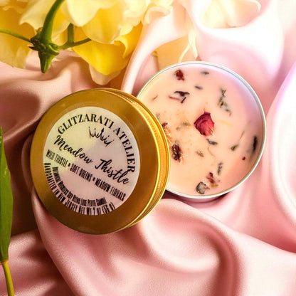 Cosmetic product with gold lid and pink container on a pink fabric background