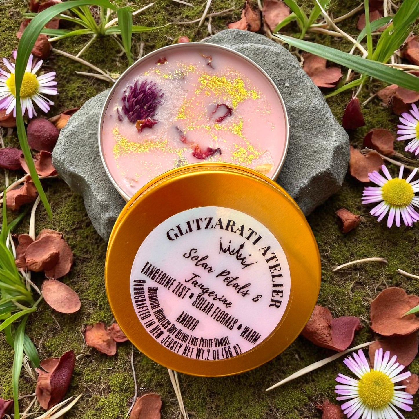 Candle in a tin with floral elements on a natural background