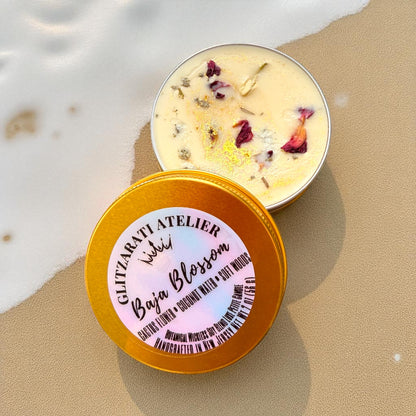 Bowl of bath salts with a lid on sand