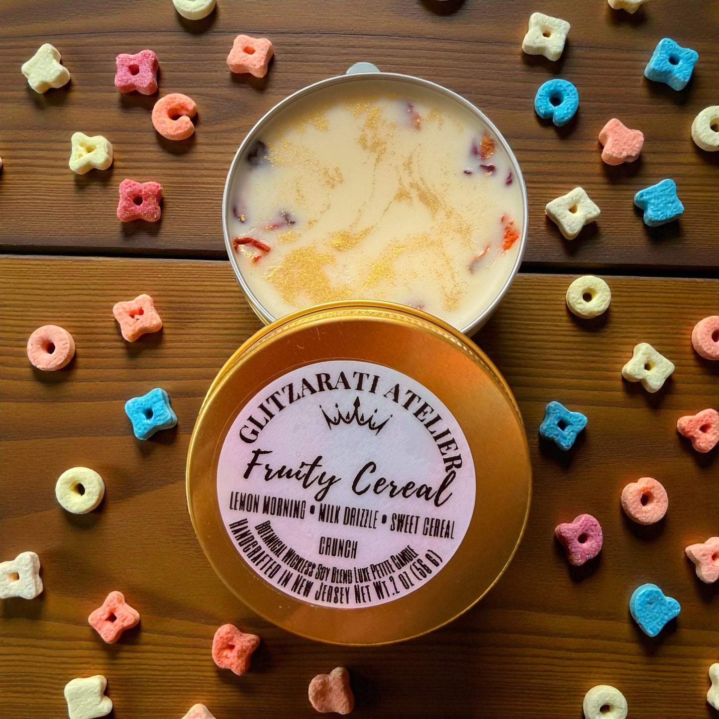 Fruity cereal in a tin with colorful cereal pieces on a wooden surface