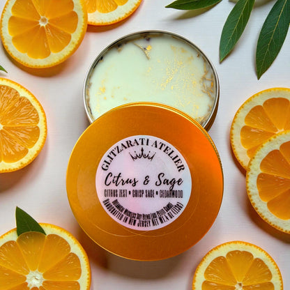 Orange-colored container with a label surrounded by sliced oranges and leaves on a light background