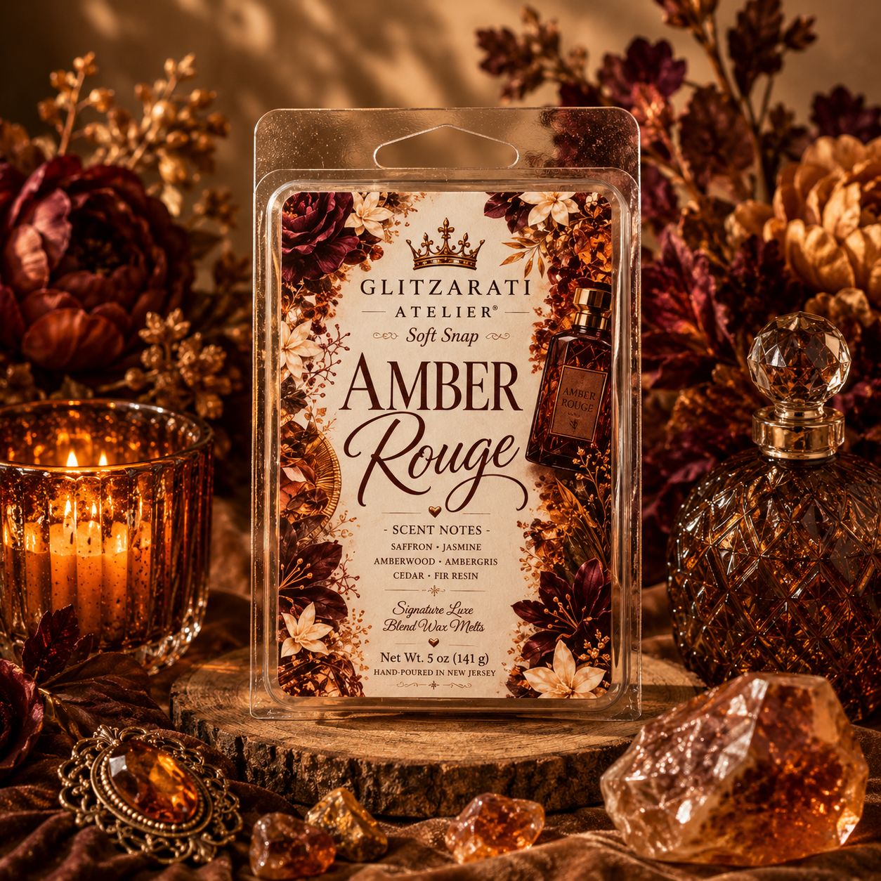 Glitzarati Atelier Amber Rouge wax melt packaging with decorative elements on a warm-toned background.