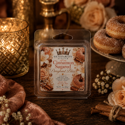 Wax melt package labeled 'Cinnamon Sugared Doughnut Bliss' on a wooden surface with decorative elements.