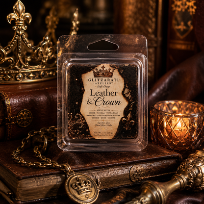 Packaged leather and crown scented wax melt with decorative background